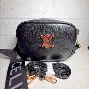 Black vegan leather fashion bag. Well made. Comes with 2 different straps.